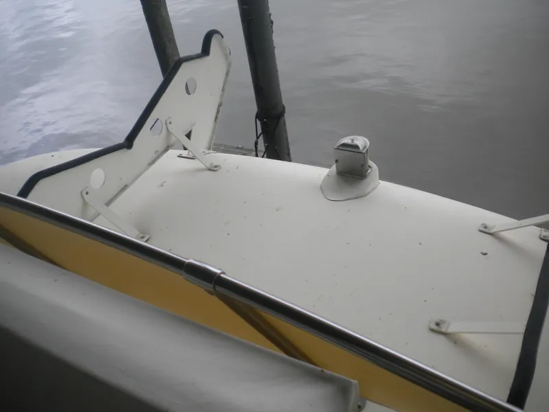 Slide: The Image of 1987 Hatteras 53 Motor Yacht deck view with railing and water backdrop. - 39