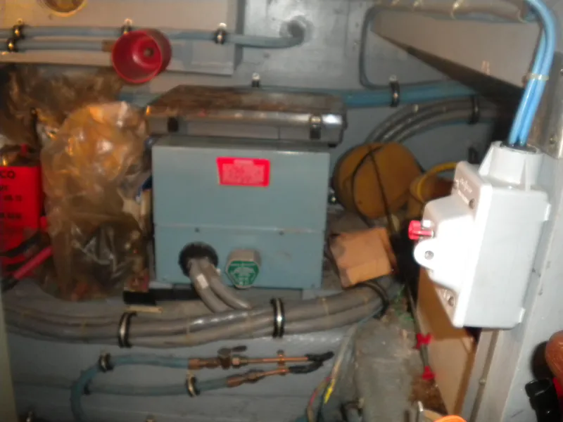 Slide: The Image of Engine room of 1987 Hatteras 53 Motor Yacht with electrical components and wiring. - 40