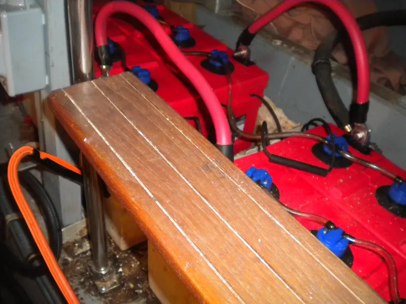 Slide: The Image of Battery compartment of 1987 Hatteras 53 Motor Yacht with red and blue wiring. - 41