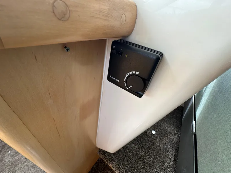 Slide: The Image of 1996 Carver Voyager interior with thermostat control on wooden panel. - 29