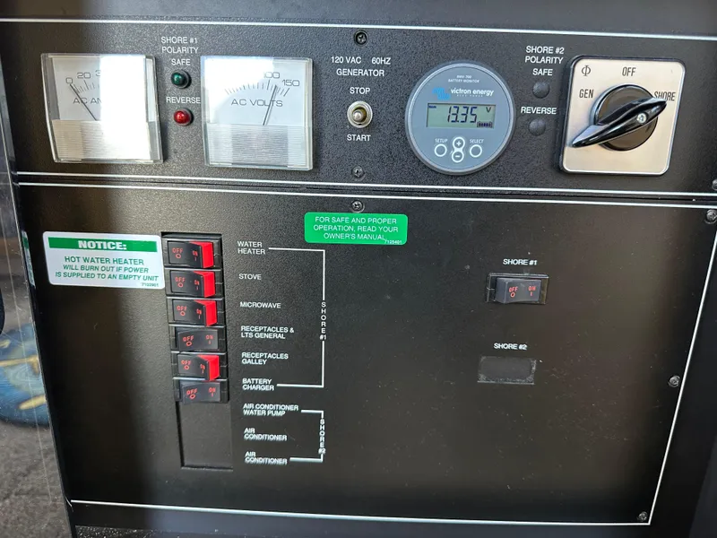 Slide: The Image of 1996 Carver Voyager control panel with generator and power switches. - 45
