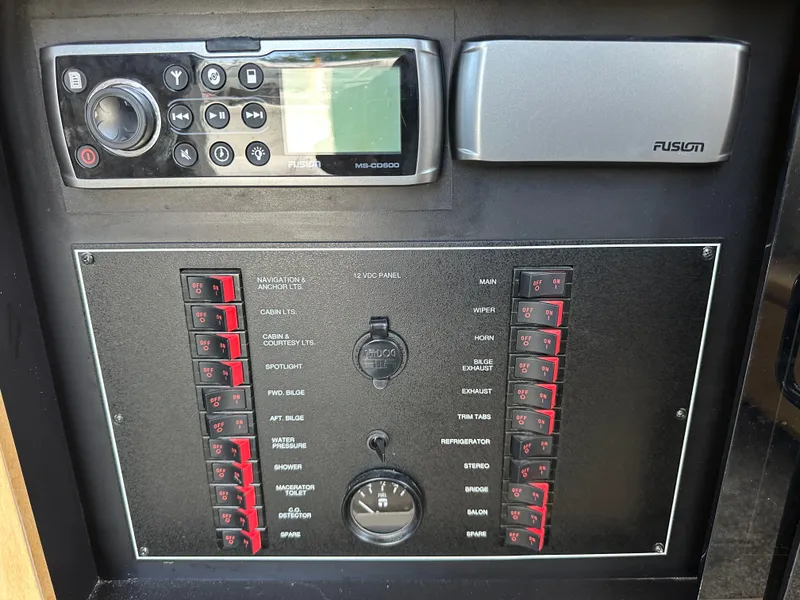 Slide: The Image of Control panel of a 1996 Carver Voyager boat with radio and switchboard. - 46