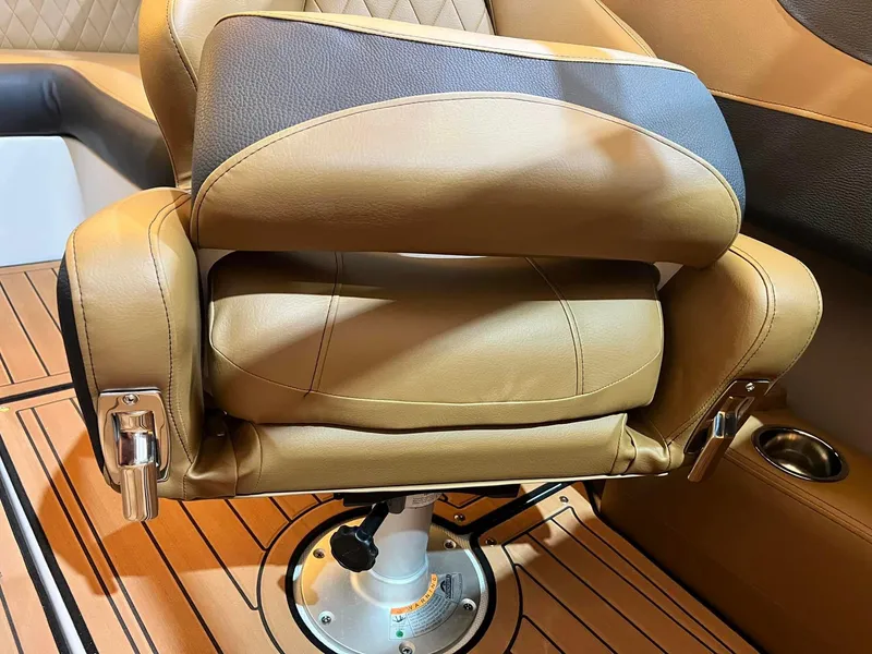 Slide: The Image of Luxurious tan leather seat in 2024 Crownline 240SS Surf boat interior. - 2