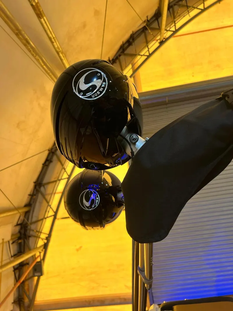 Slide: The Image of 2024 Crownline 240SS Surf boat speakers under a yellow canopy. - 8