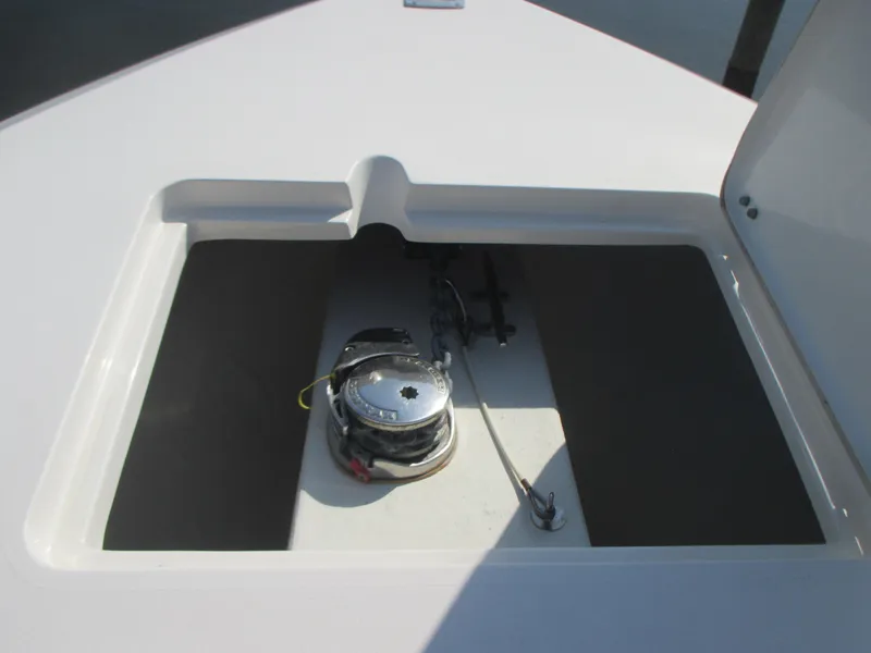 Slide: The Image of 2018 Cobia 301 Center Console boat interior with seating and console view. - 20