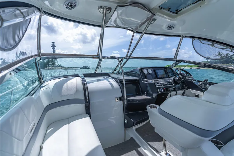 Slide: The Image of 2022 Formula 40 PC yacht interior with modern dashboard and ocean view. - 18