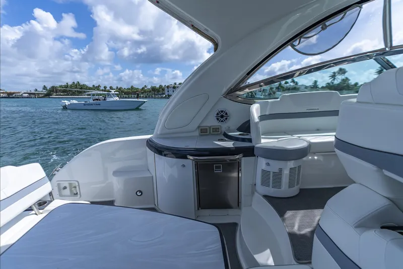 Slide: The Image of Luxurious 2022 Formula 40 PC yacht interior with ocean view and another boat in the background. - 24