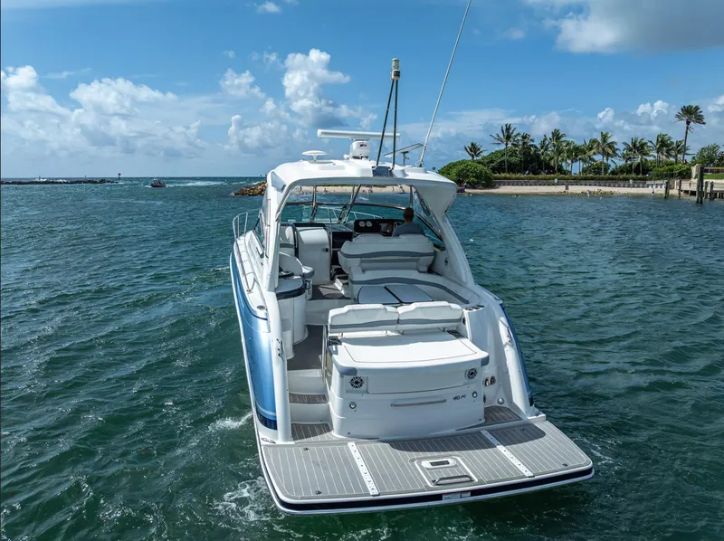 Slide: The Image of 2022 Formula 40 PC yacht cruising on a sunny day near a tropical shoreline. - 3