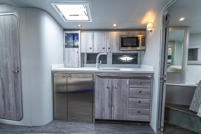 Slide: The Image of Modern kitchen interior in 2022 Formula 40 PC yacht, featuring sleek cabinetry and stainless steel appliances. - 35