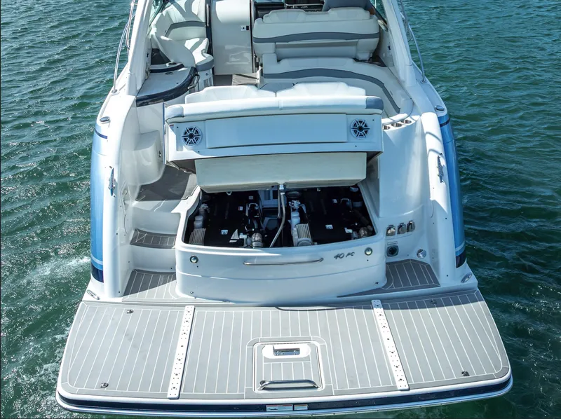 Slide: The Image of 2022 Formula 40 PC yacht with open engine compartment on water. - 42
