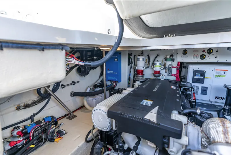 Slide: The Image of Engine compartment of 2022 Formula 40 PC boat, showcasing advanced machinery and wiring. - 45