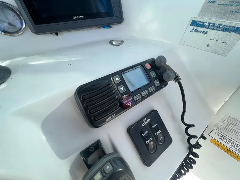 Slide: The Image of Control panel of a 2005 Sailfish 234 WAC boat with radio and navigation equipment. - 12