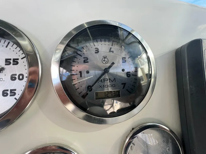 Slide: The Image of Close-up of a 2005 Sailfish 234 WAC boat tachometer showing RPM gauge. - 13