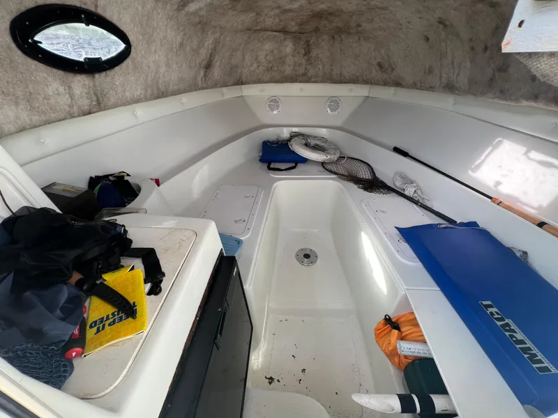 Slide: The Image of Interior of a 2005 Sailfish 234 WAC boat cabin with fishing gear. - 15