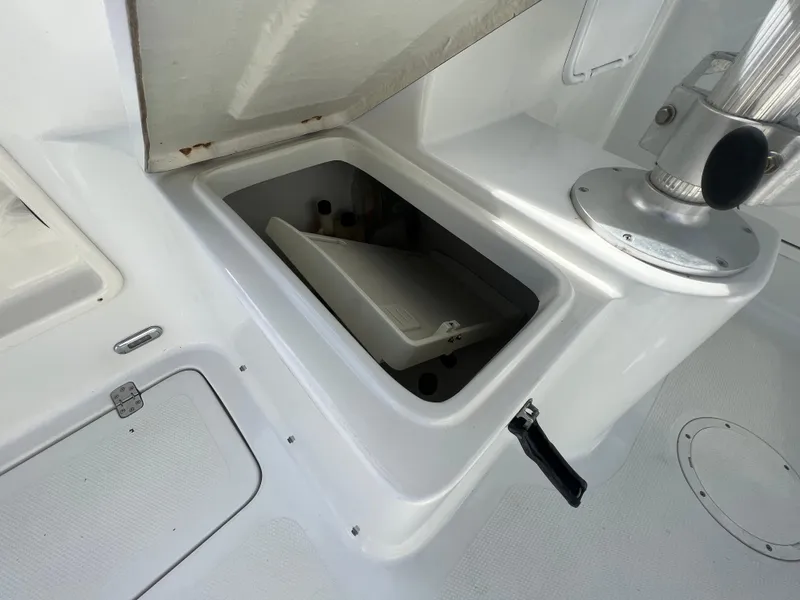 Slide: The Image of Open storage compartment on a 2005 Sailfish 234 WAC boat deck. - 21