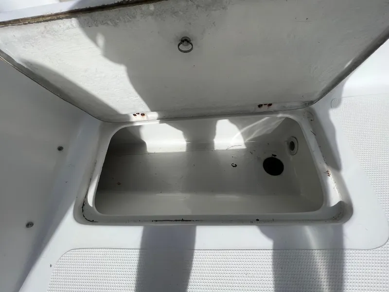 Slide: The Image of Open storage compartment on 2005 Sailfish 234 WAC boat deck. - 24