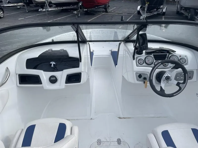 Slide: The Image of 2019 Tahoe 500 TS boat interior with steering wheel and dashboard controls. - 2