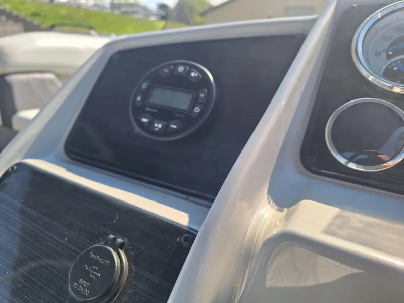 Slide: The Image of 2024 Sylvan Mirage Cruise 8520 CLZ DH dashboard with control panel and gauges. - 8