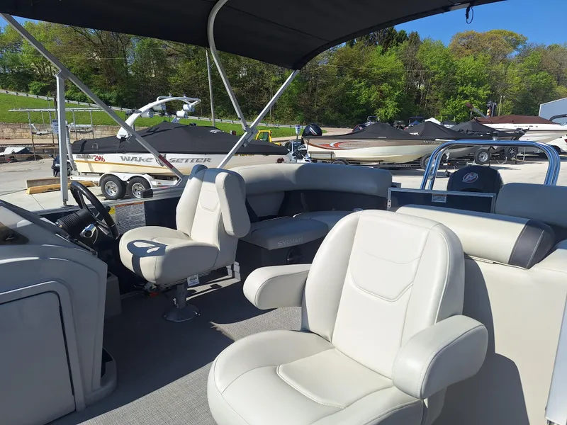 Slide: The Image of 2024 Sylvan Mirage Cruise 8520 CLZ DH pontoon boat with plush seating and canopy. - 14