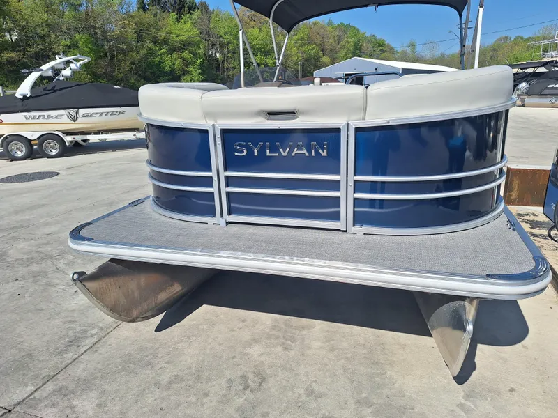 Slide: The Image of 2024 Sylvan Mirage Cruise 8520 CLZ DH pontoon boat, blue exterior, docked outdoors. - 3