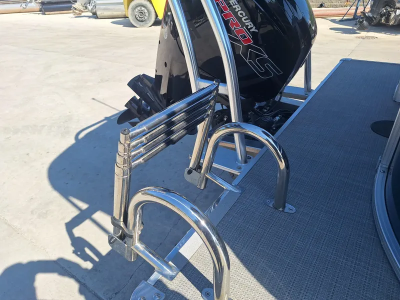 Slide: The Image of 2024 Sylvan Mirage Cruise 8520 CLZ DH boat with Mercury Pro XS engine and ladder. - 6