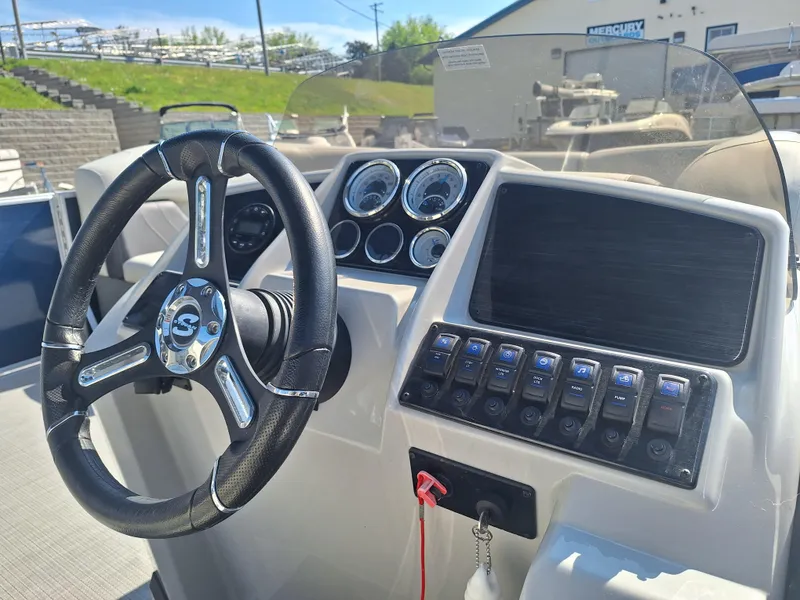 Slide: The Image of 2024 Sylvan Mirage Cruise 8520 CLZ DH dashboard with steering wheel and control panel. - 7