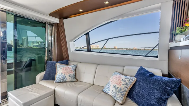 Slide: The Image of Luxurious interior of 2015 Sea Ray 510 Fly yacht with plush seating and scenic window view. - 19