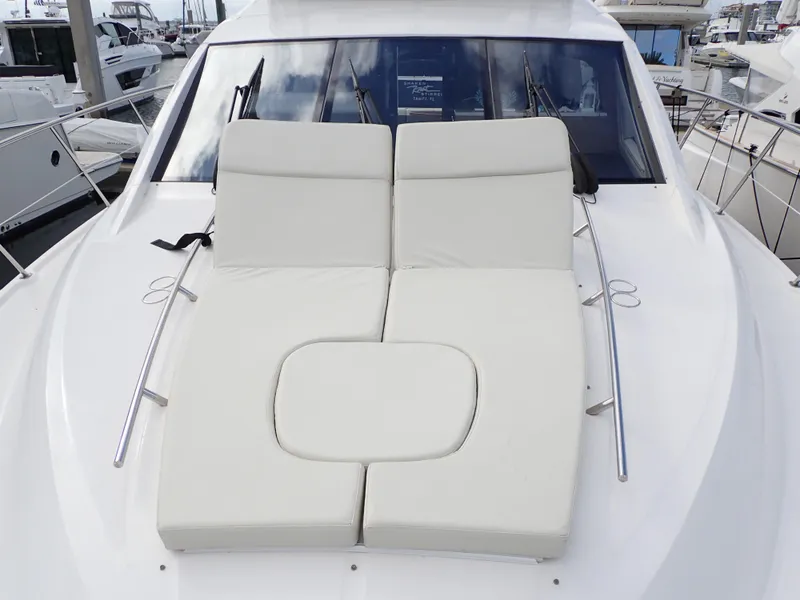Slide: The Image of 2015 Sea Ray 510 Fly yacht with cushioned sunbathing area on deck. - 30