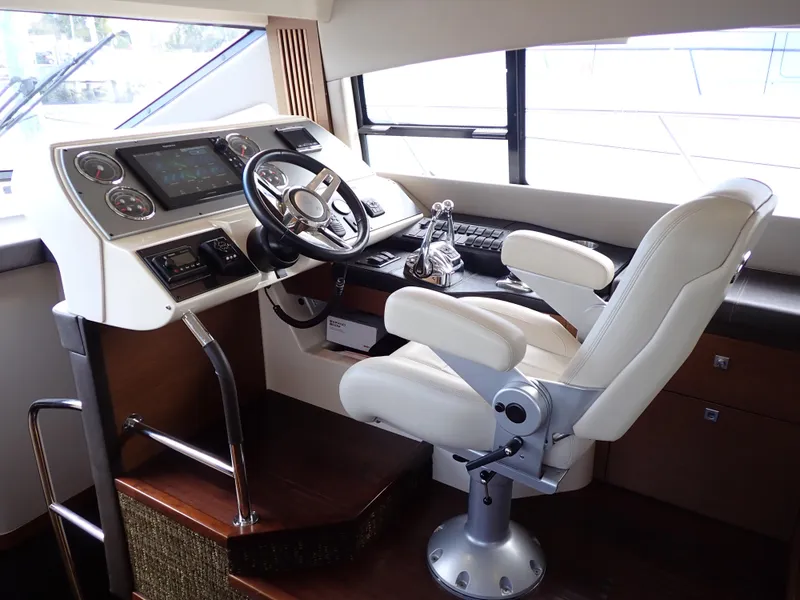 Slide: The Image of Helm station of 2015 Sea Ray 510 Fly yacht with modern controls and captain's chair. - 35