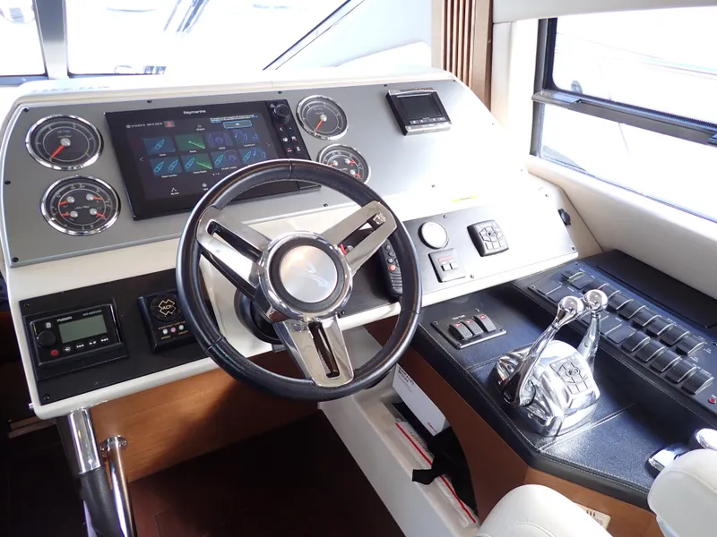 Slide: The Image of Helm of 2015 Sea Ray 510 Fly yacht with modern controls and navigation system. - 37