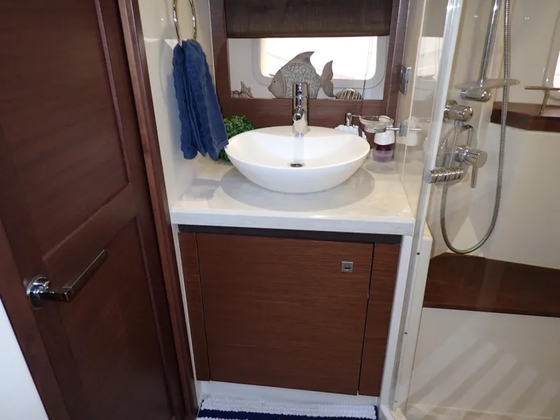 Slide: The Image of Luxurious bathroom interior of 2015 Sea Ray 510 Fly yacht with modern sink and shower. - 44