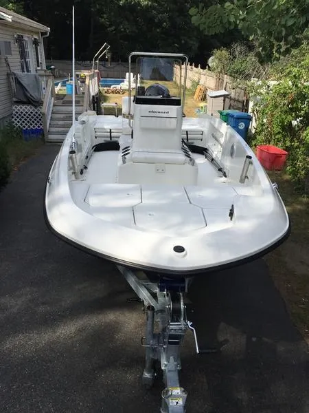 Slide: The Image of 2017 Bayliner Element F18 CC boat on trailer in driveway. - 0