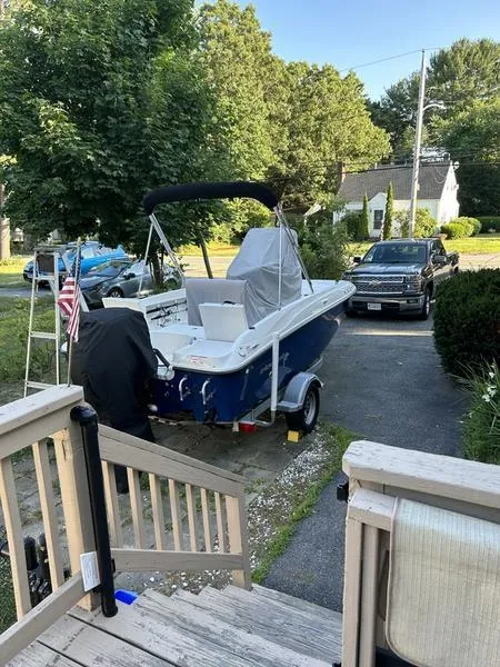Slide: The Image of 2017 Bayliner Element F18 CC boat on trailer in residential driveway. - 3