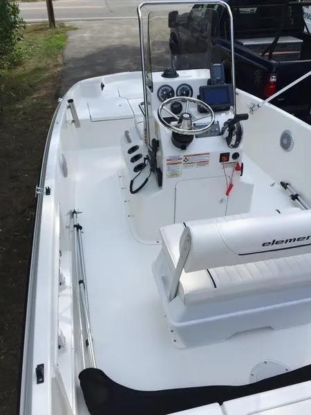 Slide: The Image of 2017 Bayliner Element F18 CC boat interior with steering console and seating. - 7