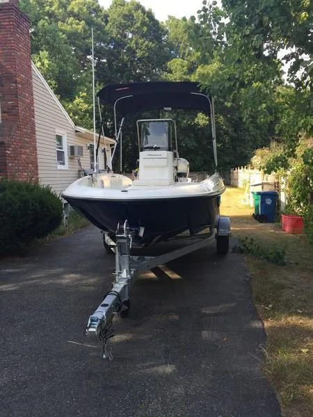 Slide: The Image of 2017 Bayliner Element F18 CC boat on trailer, parked in driveway. - 8