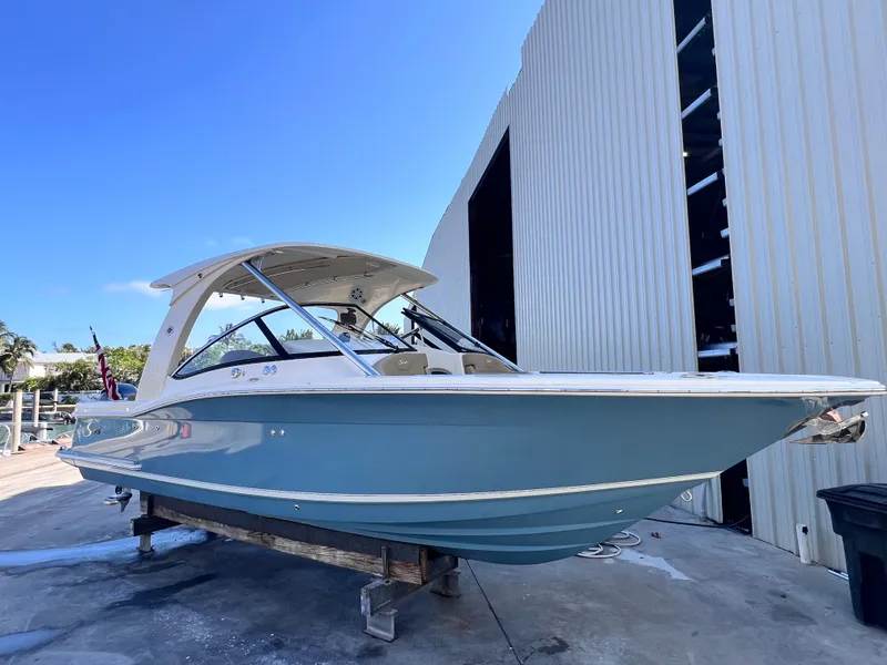 The Image of 2018 Scout 275 Dorado boat on display outside a large storage facility. - 0