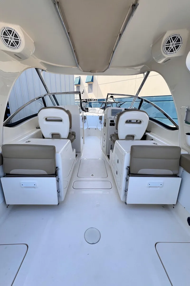 Slide: The Image of 2018 Scout 275 Dorado boat interior with seating and steering area. - 5