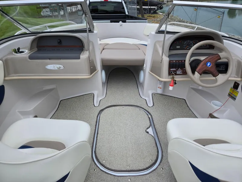 Slide: The Image of 1998 Four Winns Horizon RS RX boat interior with steering wheel and seating. - 11