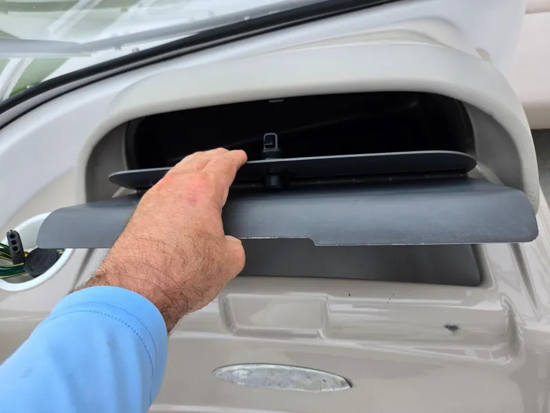 Slide: The Image of Hand opening compartment on 1998 Four Winns Horizon RS RX boat. - 16