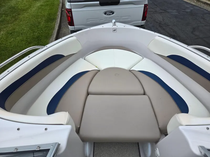 Slide: The Image of 1998 Four Winns Horizon RS RX boat interior with beige and blue seating. - 17