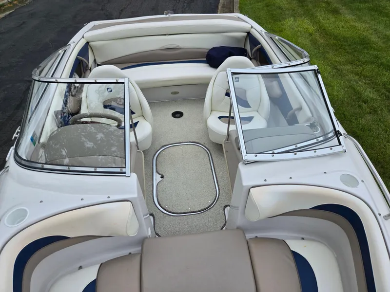 Slide: The Image of 1998 Four Winns Horizon RS RX boat interior with white seating and windshield. - 19