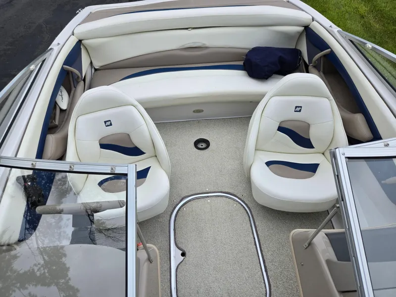 Slide: The Image of 1998 Four Winns Horizon RS RX boat interior with white seating and blue accents. - 20