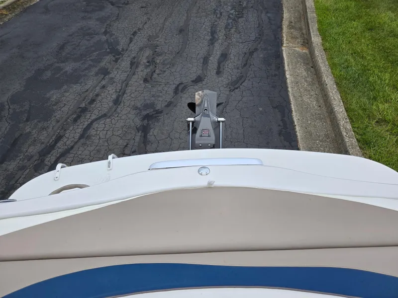 Slide: The Image of 1998 Four Winns Horizon RS RX boat on a paved road, viewed from above. - 23