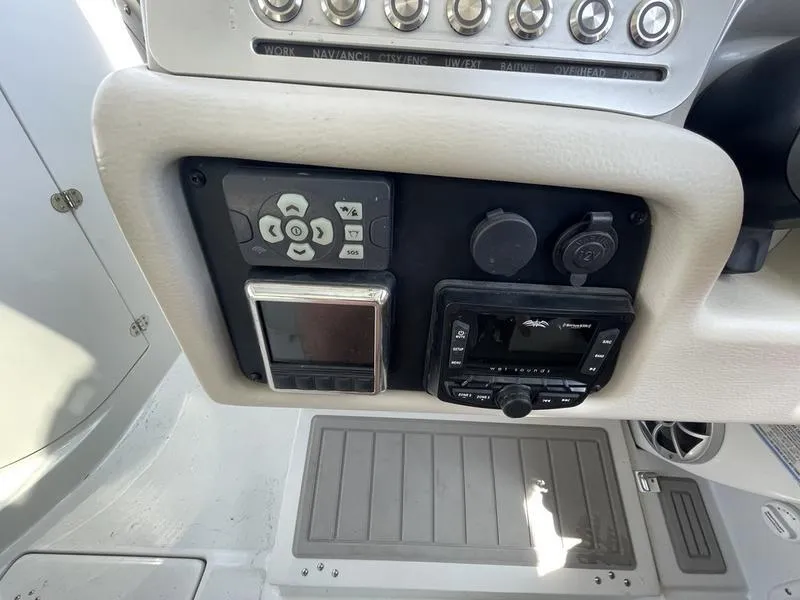 Slide: The Image of Control panel of 2022 Finseeker 280 DC boat with navigation and audio systems. - 11