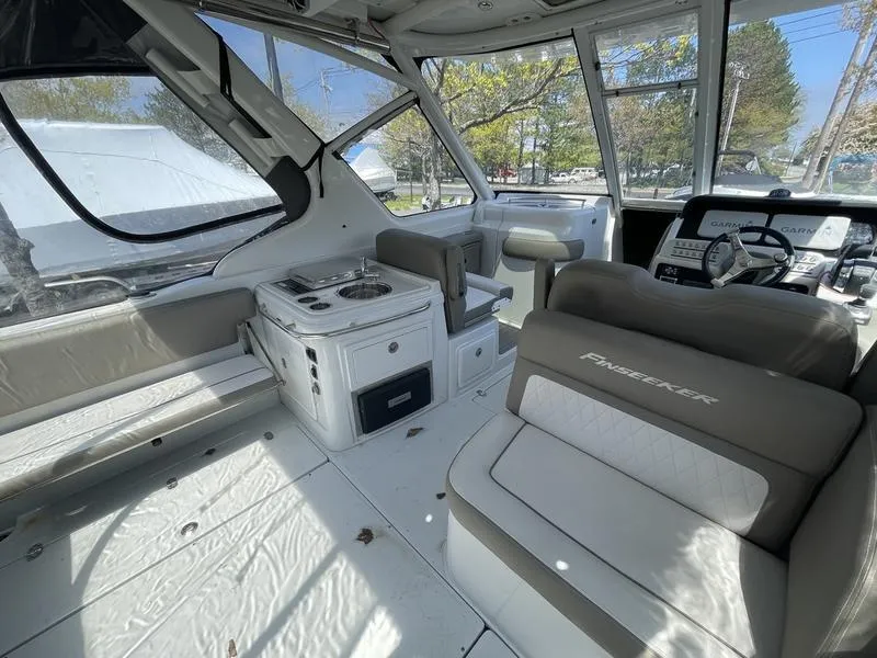 Slide: The Image of Interior of 2022 Finseeker 280 DC boat with seating and helm. - 4