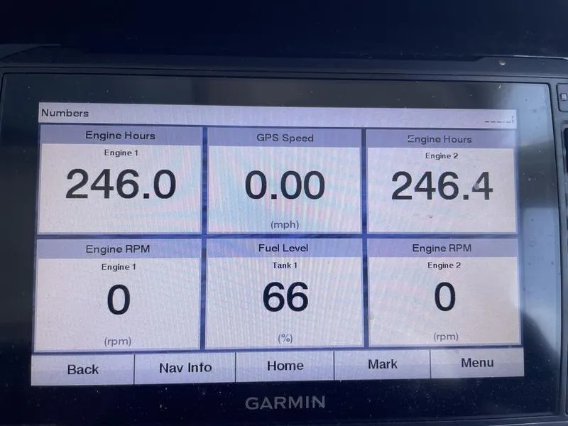 Slide: The Image of Garmin display showing engine hours, GPS speed, and fuel level on 2022 Finseeker 280 DC. - 7
