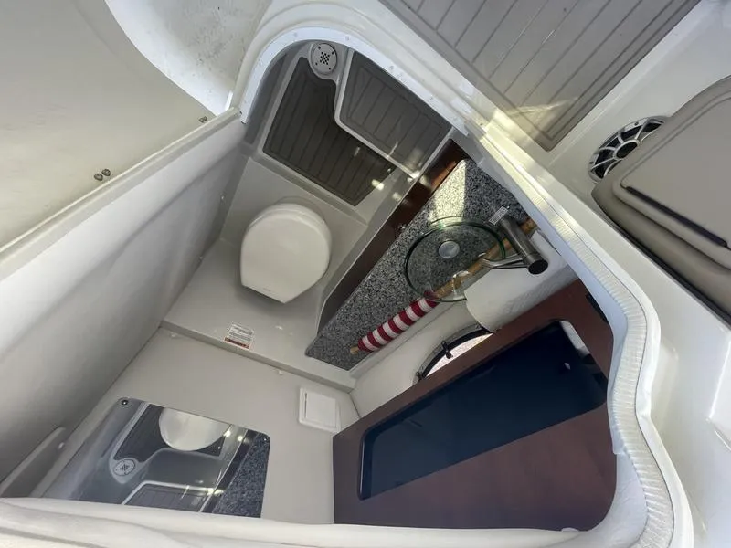 Slide: The Image of Interior of 2022 Finseeker 280 DC boat bathroom with sink and toilet. - 9