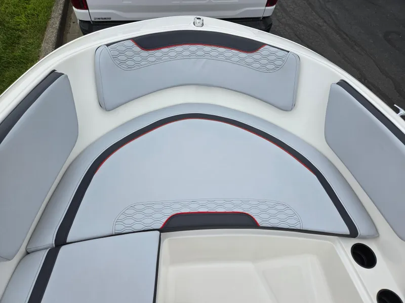 Slide: The Image of 2022 Bayliner Element M15 boat interior with cushioned seating and modern design. - 13