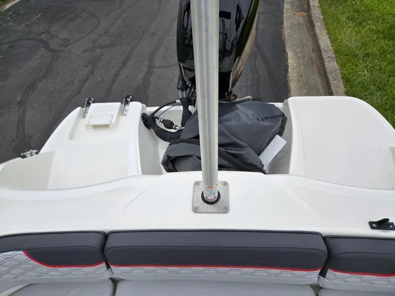 Slide: The Image of 2022 Bayliner Element M15 boat interior with seating and motor view. - 18