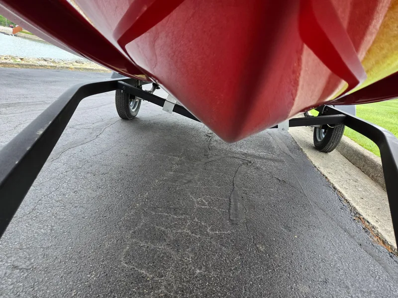 Slide: The Image of 2022 Bayliner Element M15 boat on trailer, viewed from below. - 7